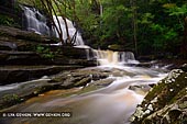 landscapes stock photography | Lower Cascades of Somersby Falls after Rain, Brisbane Water National Park, Central Coast, NSW, Australia, Image ID SOMERSBY-FALLS-NSW-AU-0009. Somersby Falls flows year-round in a rainforest near Gosford in Brisbale Water National Park on the Central Coast. It is best seen after heavy rain when brown coloured water cascade over picturesque green mossy rocks.