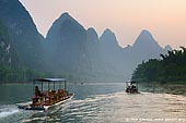 landscapes stock photography | Li River Cruise, Yangshuo, China, Image ID CHINA-YANGSHUO-XINGPING-0006. Cruise the Li River from Guilin to Yangshuo is the highlight of any trip to Guilin and Guangxi province in China. The landscape is decorated with rolling hills, steep cliffs, fantastic caves, leisurely boats and is lined with bamboo. Li River offers stunning views of the karst formations and landscape in the world.