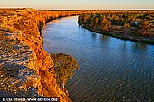 landscapes stock photography | Sunset at Murray River Big Bend, Murray River, South Australia, Australia, Image ID AU-MURRAY-RIVER-0008. Big Bend in South Australia is the longest single bend in the Murray River. The area is known for its spectacular riverside cliffs, which are the tallest along the Murray River. The limestone cliffs are rich with millions of ocean fossils and are home to colonies of bats. Caves in the area have been continuously occupied for at least 8,000 years and are sacred to the local aboriginal community. There is a collection of holiday shacks located on the banks. Big Bend cliffs are located near Nildottie and Swan Reach where you can visit by boat or take a road trip, only one and half hours from Adelaide or 40 minutes from Mannum.