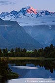 landscapes stock photography | Mt Tasman at Sunset, Lake Matheson, South Westland, South Island, New Zealand, Image ID NZ-LAKE-MATHESON-0004. Sunset over the second highest peak in New Zealand - Mt. Tasman (3,497m) with reflection in beautiful Lake Matheson near Fox Glacier township, situated in Westland National Park on West Coast of the South Island of New Zealand.