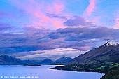 landscapes stock photography | Lake Wakatipu near Glenorchy at Dawn, Queenstown, Lakes District, Otago, South Island, New Zealand, Image ID NZ-LAKE-WAKATIPU-0005. The colourful blue and pink sky at sunrise over the Lake Wakatipu from Bennett's Bluff lookout on the road from Queenstown to Glenorchy on the South Island of New Zealand.