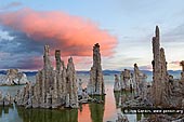 landscapes stock photography | Sunrise at Lake Mono, Mono Lake Tufa State Reserve, Eastern Sierra, Mono County, California, USA, Image ID USA-LAKE-MONO-0004. The best-known feature of Mono Lake in California, USA are its dramatic tufa (TWO-fuh) towers. Over time, rainfall at Mono Lake did not keep up with evaporation, and minerals in the water built up until the lake is now 2 1/2 times as salty and 80 times as alkaline as the ocean. When the lake level was higher, freshwater springs flowed into the lake under the surface and reacted with the lake's minerals to form the dramatic cement-like calcium carbonate spires and towers that line Mono Lake shores today, looking like abandoned ancient cities.