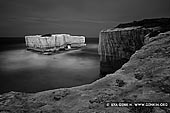 portfolio stock photography | The Bakers Oven in Black and White, The Twelve Apostles, Great Ocean Road, Port Campbell National Park, Victoria, Australia, Image ID GREAT-OCEAN-ROAD-BW-0003. The Bakers Oven in the Port Campbell National Park near the Twelve Apostles in Victoria, Australia is so called for the oven-like hole in the island and a small rock, shaped like a loaf of bread, that once sat on the ledge.