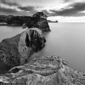 portfolio stock photography | Dogashima Islands, Nishiizu Dogashima, Izu Peninsula, Shizuoka Prefecture, Japan, Image ID JAPAN-DOGASHIMA-0001. Dramatic rock formations and deep caves at Dogashima on the western coast of the Izu Peninsula near Nishi-Izu in Japan caused by volcanic eruption and natural erosion draw visitors to this photogenic strip of coastline. The western coast of the Izu Peninsula has many hidden wonders for you to explore and miles of delightful hiking trails. The best way to see the coast is from one of the frequently departing sightseeing boats, which briefly enter one of the larger caves.