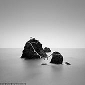 portfolio stock photography | Meoto Iwa #1 (The Wedded Rocks), Futami, Mie Prefecture, Japan, Image ID JAPAN-MEOTO-IWA-0001. Meoto Iwa (The Wedded Rocks) - two sacred rocks in the ocean near Futami, Ise City, Mie Prefecture, Japan. The larger of the two rocks represents the husband and the smaller one represents the wife. Both rocks are connected by a shimenawa rope which acts as the division between the spiritual and earthly realms. In a ceremony, the shimenawa rope is replaced three times a year.