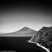 portfolio stock photography | Mt. Fuji from Izu Peninsula, Shizuoka Prefecture, Japan, Image ID JAPAN-MOUNT-FUJI-0001. The western coast of the Izu Peninsula offers good views of Mount Fuji, especially from around Heda where you can see the mountain in combination with beautiful coastal scenery. The Izu Peninsula is a resort area popular for its hot springs, beautiful coastlines, beaches, mild climate and scenic mountainous interior. Located about 100 kilometers southwest of Tokyo, its proximity to the city makes the peninsula a popular weekend getaway and the area is well connected to Tokyo by train. In addition, Mount Fuji lies only about 50 kilometers to the north and can be viewed from the peninsula's western coast.