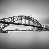 portfolio stock photography | Sydney Opera House and Harbour Bridge, Milsons Point, Sydney, NSW, Australia, Image ID SYDNEY-IN-SQUARE-0009. Black and white fine art photo of the Sydney Opera House and the Harbour Bridge with the Sydney City in a background early in the morning as it was seen from Luna Park in Milsons Point, NSW, Australia.