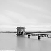 portfolio stock photography | Prospect Reservoir, Sydney, NSW, Australia, Image ID SYDNEY-IN-SQUARE-0017. The Prospect Reservoir is a heritage-listed 50,200-megalitre potable water supply and storage reservoir created by the Prospect Dam, across the Prospect Creek located in the Western Sydney suburb of Prospect, in New South Wales, Australia. The eastern bounds of the reservoir are a recreational area and the western periphery are within the bounds of Western Sydney Parklands. It was added to the New South Wales State Heritage Register on 18 November 1999. Prospect Reservoir is Sydney's largest reservoir and stores water conveyed from Warragamba Dam, the Upper Nepean Dams (Cataract, Cordeaux, Avon and Nepean) and if necessary, from the Shoalhaven Scheme, for supplying the larger component of the water distribution system of the Sydney metropolis. Located approximately 34 km west of Sydney, the reservoir is a zoned earth embankment dam, 26m high and approximately 2.2 km long, with a storage capacity of 50,200 megalitres and an open capacity of 8,870 megalitres.