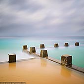 portfolio stock photography | Coogee Rock Pool, Study 1, Sydney, NSW, Australia, Image ID SYDNEY-ROCK-POOLS-0002. Contemporary minimalist photography of the tidal pool at the Coogee Beach in Sydney, NSW, Australia with dramatic clouds.