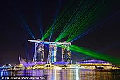  stock photography | Marina Bay Sands Light and Water Show, Marina Bay, Singapore, Image ID SINGAPORE-0011. Light, laser and Water fountain Show at Marina Bay Sands is a must see event overlooking the beautiful Marina Skyline. Marina Bay Sands' Light and Water show combines five key elements: light, video, audio, water, and fire. For approximately fifteen minutes, you will be immersed into a laser light and water fountain show with projected images and videos telling about man's journey to life, with orchestral music (and Louis Armstrong's 'What a Wonderful World') at the background. Converging all the other elements like the dazzling pyrotechnics display and the bubbles floating up above (kids will surely enjoy it), it definitely sums up to one breathtaking and visually-appealing show like no other. There are also other places/tourist spots in the vicinity like the Merlion Park, Helix bridge, The Shoppes, Singapore Flyer, and the iconic Marina Bay Sands Hotel's Skypark where you can visit right after watching the show. Or if you're already tired, you can just eat at nearby restaurants and watch the scenic view of the buildings at the bay area.