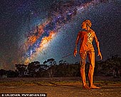  stock photography | Milky Way Raising over Heart of Country, Sculpture Down the Lachlan, Lachlan Valley Way, Condobolin, NSW, Australia, Image ID HEART-OF-COUNTRY-AND-MILKY-WAY-0001. Sculpture Down the Lachlan is the newest tourist attraction in the Central West of NSW. The 100-kilometre arts trail starts in Forbes and follows the Lachlan River along the Lachlan Valley Way to Condobolin. But Sculpture Down the Lachlan isn't your ordinary public art trail - think Sculptures by the Sea... but in the bush. Art embedded in nature. Designed to showcase the raw, unmanicured beauty of the rural landscape in which envelops the larger-than-life installations. Featuring over twenty sculptures by some of Australia's leading creatives. The most prominent is the Heart of Country by Damian Vick. He stands proudly at six metres tall. His bold stance and keen focus cut a potent and deadly impression whilst making the inescapable suggestion that he is searching for something unseen, lost along the way, relegated to the past. The one-tonne Corten Steel sculpture explores the notions of strength, vulnerability and connection. 'Heart of Country' is an attempt to acknowledge the injustices endured by the Wiradjuri people whilst also standing as a testament to the collective resilience and determination of all indigenous Australians and their profound spiritual connection with the land.