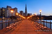 usa stock photography | Pier 7 and Transamerica Pyramid in the Evening, San Francisco, California, USA, Image ID US-SAN-FRANCISCO-0002. Pier 7 and the Transamerica Pyramid building during nightfall in San Francisco, California, USA. Pier 7 provides some of the best views of San Francisco's skyline. From the pier you can see Coit Tower, the Transamerica Pyramid, skyscrapers in the financial district, and the Oakland Bay Bridge. The pier was originally built in 1901, but it was damaged in the 1989 Loma Prieta Earthquake and subsequently was demolished and rebuilt. The pier is 840 feet long and extends into water 35 feet deep.