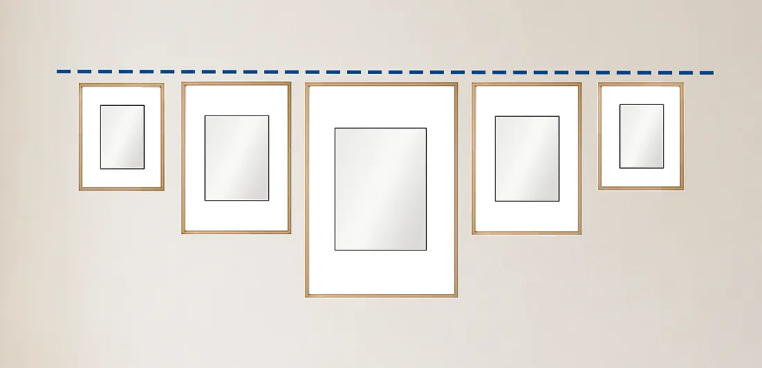 Hanging pictures in a row so that the top lines of all pictures line up.
