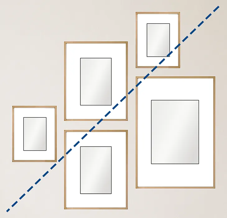 Arrange the pictures so the viewer's eye naturally moves upward on a diagonal. Combine vertical and horizontal frames to keep the composition varied, and keep the spacing between frames consistent. A gap of around 5–10 cm, or 2–4 inches, usually works well.