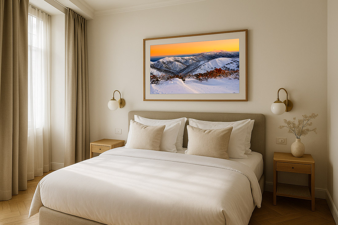 Boutique hotel bedroom with curated fine art landscape prints